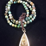 Golden Buddha Amulet on African Turquoise prayer beads mala bracelet