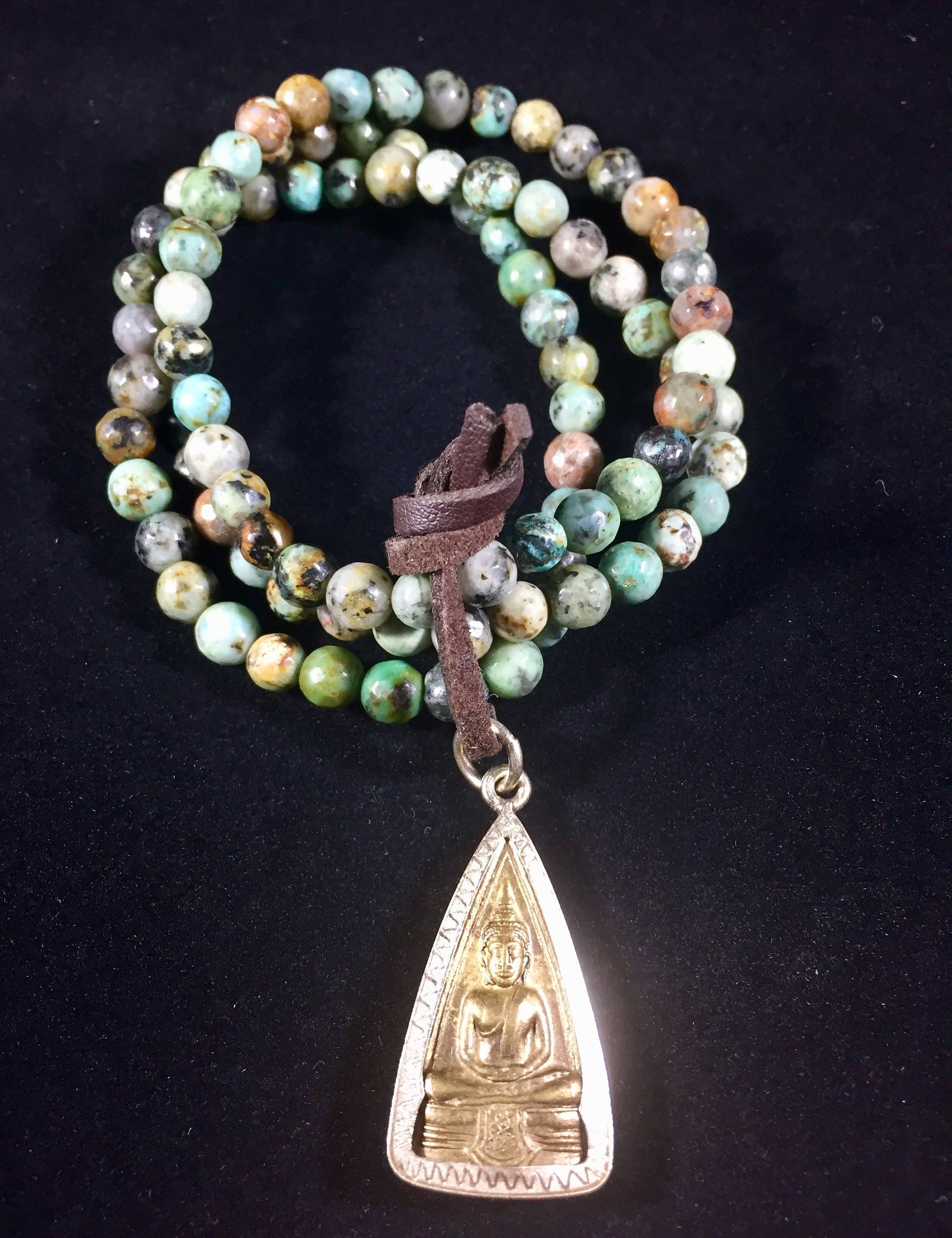 Golden Buddha Amulet on African Turquoise prayer beads mala bracelet