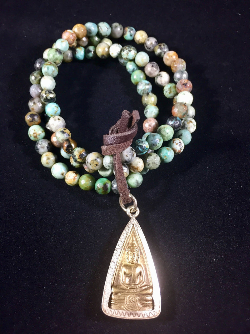 Golden Buddha Amulet on African Turquoise prayer beads mala bracelet